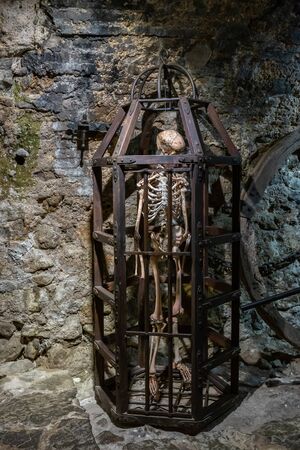 Medieval Metal cage with skeleton for tortureの写真素材