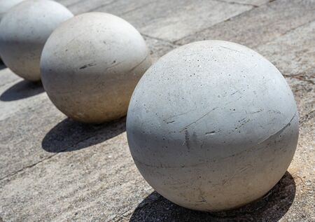 Concrete balls on concrete roadの写真素材