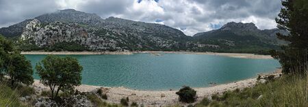 Panorama, Picturesque landscape with a turquoise lake in the mountains of Tramontana on the island of Mallorcaの写真素材
