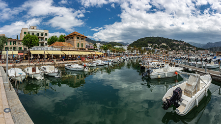 Soller, Spain - 26.05.2019: Panorama seafront and harbour at Port de Soller with yachts and boatsのeditorial素材