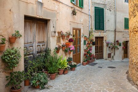 A cozy street  with flowers in the old town of Valdemossaの写真素材