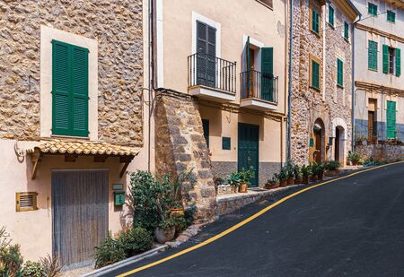 street  with flowers in the old town of Banyalbufar, Spainの写真素材