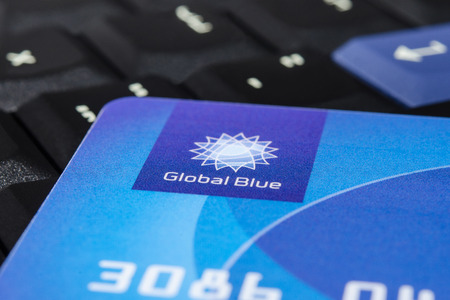 MUNICH, GERMANY - FEBRUARY 20, 2014  Plastic  Global Blue  card on laptop ThinkPad keyboard  Easy for tax free shopping のeditorial素材