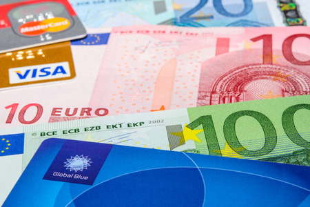 MUNICH, GERMANY - FEBRUARY 23, 2014: Global Blue, Visa and MasterCard credit cards on Euro banknotesのeditorial素材