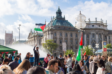 MUNICH, GERMANY - AUGUST 16, 2014: Demonstration in support of Palestine in the center of Europe. European activists demand the cessation of hostilities in Gaza Strip.のeditorial素材