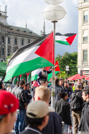 MUNICH, GERMANY - AUGUST 16, 2014: The demonstration in the center of a large European city. Protesters are demanding a peaceful solution to the Arab-Israeli conflict, the cease-fire in Gaza and the liberation of occupied Palestinian territories.のeditorial素材
