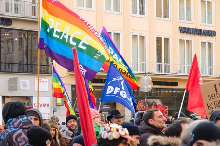 Munich, Germany - February 07, 2015: European peaceful march with flags, placards and banners on...