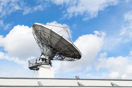 Large satellite communication parabolic dish radar antenna station or astronomical observatory space radio signal telescope against skyの写真素材