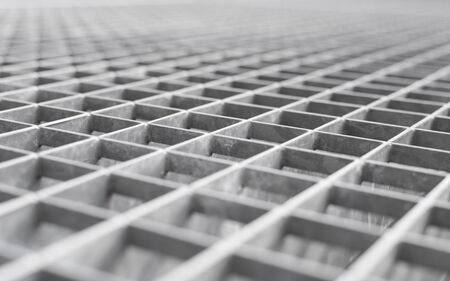 Angle metal lattice background with shallow DOF and selective focus point on small cells of gridの写真素材