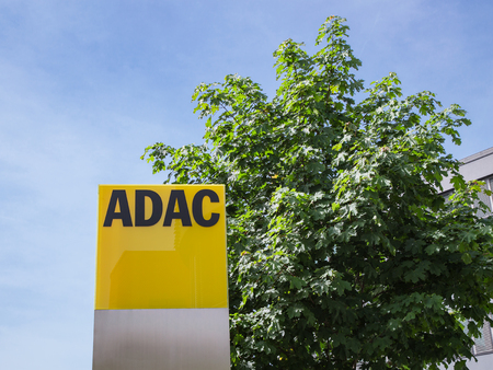 Munich, Germany - May 12, 2015: ADAC signage with German automobile club logo largest automobile association in Europe.のeditorial素材