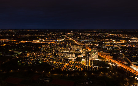 Aerial panoramic cityscape view with bright lights in night Munichの写真素材
