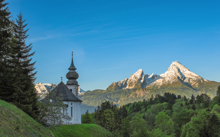 Morning panoramic landscape with Maria Gern chapel and snow-capped peaks of Watzmann mountain in Bavarian national park Berchtesgadenの写真素材