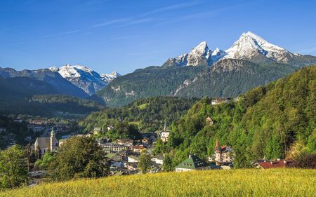 Panoramic landscape view of German small tourist town Berchtesgaden with snow-crowned Watzmann mount in Bavarian Alpsの写真素材