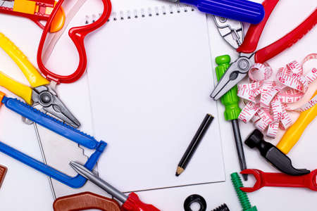 children's game technical tools with Notepad and pencil on a white background