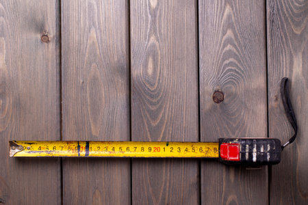 old roulette of a worker on a textured wooden background