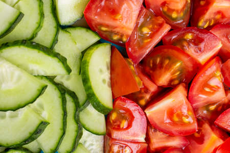Coarsely chopped fresh vegetable salad in a large plate. Top viewの写真素材
