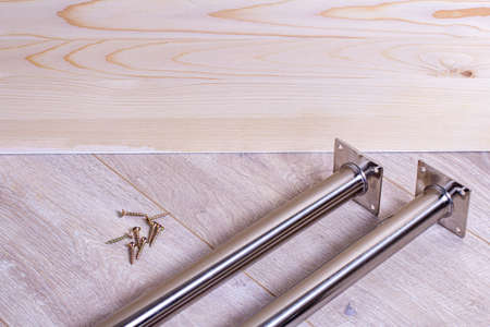 Metal legs for table mounting and screws. Furniture accessories. Table support.の写真素材