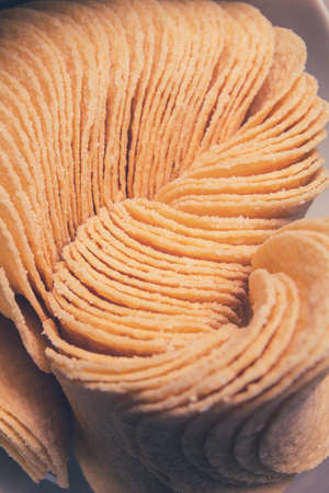 crispy natural potato chips close-up. tinted image