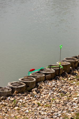 Fishing gear in a calm style in green and red tones for outdoor recreation