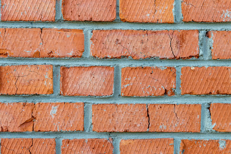 Brick wall in macro style in orange and gray tones for construction and texture