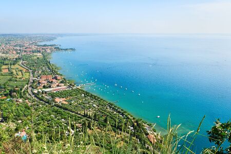 View to the south-east part of Garda lake from the high mountain in one beutiful day of summerの写真素材