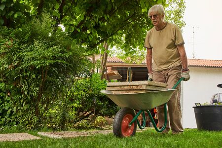 Senior man in retirement working in the garden