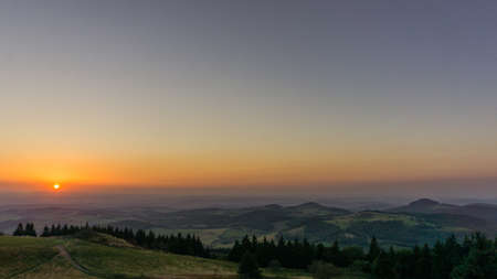 Sunset from Wasserkuppe, the highest point in Roehn Mountains under a clear sky, Germanyの写真素材