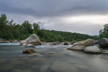 Long exposure of river in spanish pyrenees with rocksの写真素材