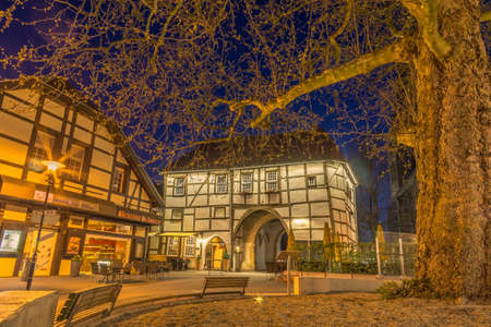 Old truss buliding in city at blue hour in the night, Lengerich, Germanyの写真素材