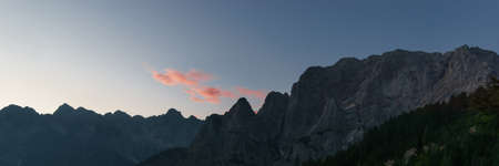Panorama of the Julian Alps at sunrise from paving stone corner of Vrsic-Pass, Sloveniaの写真素材