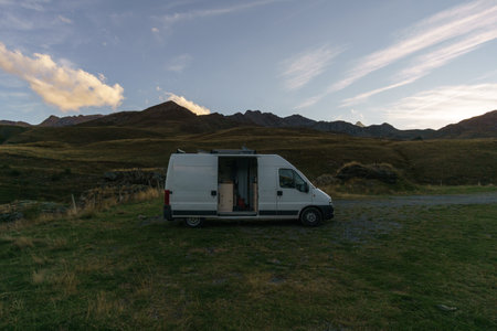 Camper Van in the Pyrenees Mountains at the french and spanish border during sunset, Frontera del Portalet, Huesca, Spainの写真素材