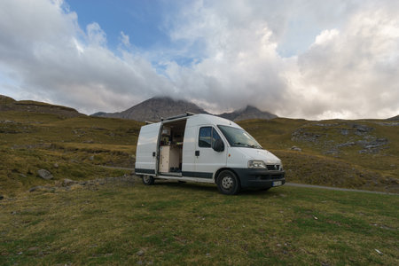 Beautiful mountain landscape near Gavarnie with camper van on meadow at Col de Tentes in the...