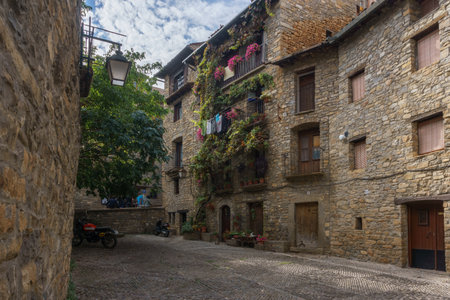 Street with stone houses in the medieval village of Ainsa in the pyrenees, Aragon, Spainの写真素材