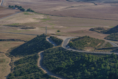 View of the Bardena Negra or Bardena black desert landscape of Bardenas Reales with vegetation, Navarra, Spainの写真素材