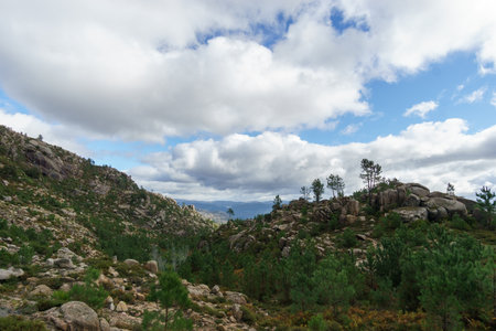 Mountain landscape of granite rocks with green vegetation, Peneda-Geres National Park, Vilar da...