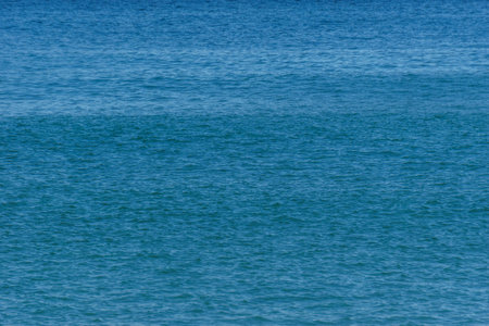 Blue ocean waves at the water surfaceの写真素材