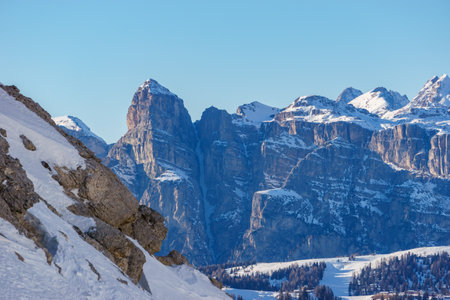 Idyllic view at dolomite mountain landscape during winter with snow covered peaks at pass road of Valparola, South Tirol, Italyの写真素材