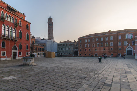 Campo San Anzolo square and the bell tower of the Stanto Stefano Church on a sunny winter evening, Venice, Veneto, Italyの写真素材