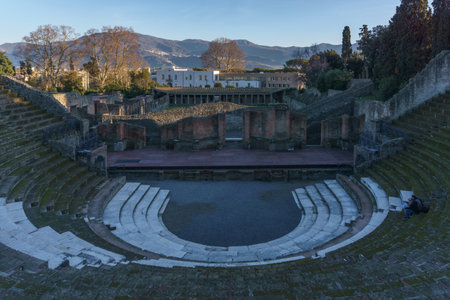 View of the ruins of Teatro Grande during golden hour at evening, Pompeii, Campania, Italy
