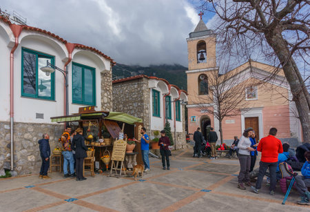 People enjoying lemonade in front of a store at the village square of Nocelle at the Amalfi Coast, Province of Salerno, Campania, Italyの写真素材