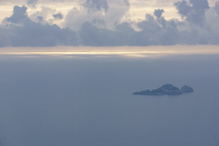 View of the rocky landscape over the sea along the Amalfi Coast with small island, Province of Salerno, Campania, Italyの写真素材