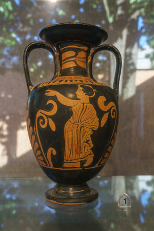 Ancient clay pot called Amphora, painted with black figures on a red backgroundの写真素材