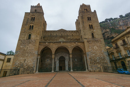 Facade of Cathedral Duomo di Cefalu on cloudy rainy day, Cefalu, Sicily, Italy.の写真素材