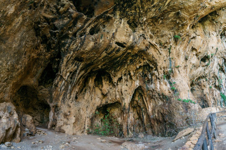 Close up view of rocks from large prehistoric cave Grotta dell'Uzzo at the Zingaro Nature Reserve,...