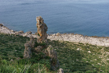 Rocky coastline with turquoise colored water at Nature Park of Monte Cofano at mediterranean sea, San Vito Lo Capo, Sicily, Italyの写真素材