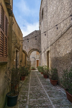Townscape of medieval streets on a sunny day with blue sky, Erice, Sicily, Italyの写真素材