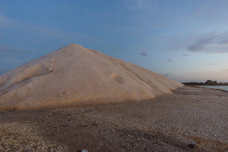 Blue hour during evening twilight after sunset at nature reserve Saline di Trapani with salt heap besides salt fields, Contrada Nubia, Sicily, Italyの写真素材