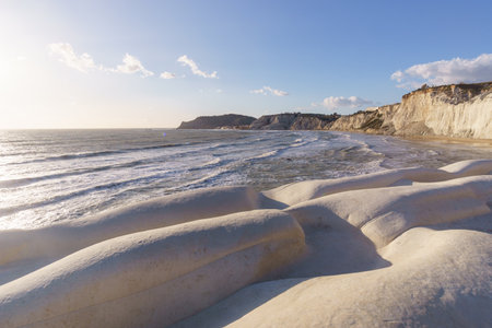 View of white rock cliff Stairs of the Turks or Scala dei Turchi at the mediterranean coast during golden hour at sunset, Realmonte, Sicily, Italyの写真素材