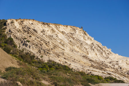 View of coastline at nature reserve of Torre Salsa with beautiful white cliffs Dama Bianca Torre Salsa on a sunny day, Sicily, Italyの写真素材