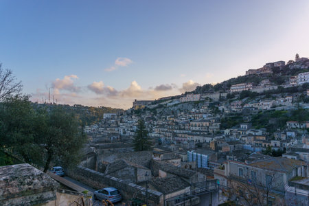 Townscape of the houses in the city during evening twilight, Modica, Sicily, Italy